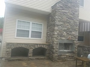 cultured stone outdoor chimney fire place with wood storage box boral bucks county country ledgestone